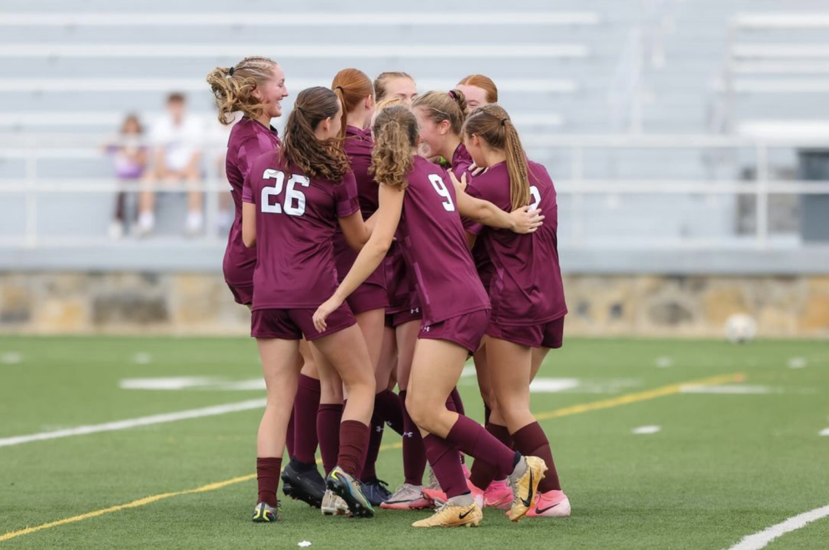 The Lady Vikings huddled around after winning the District Championship qualifier game on October 9th.

